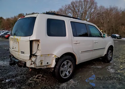 2011 Honda Pilot Touring z USA, uszkodzony, nr VIN 5FNYF4H9XBB101935